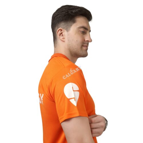 Orange corporate polo t shirt made with micro dri-fit fabric featuring vertical logo branding, worn by male model, ideal for corporate uniforms and promotional events