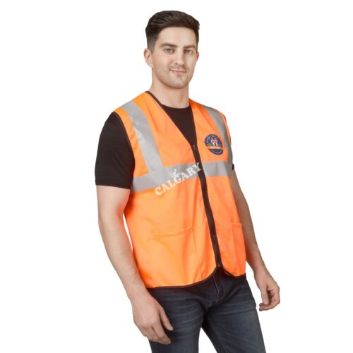 Man wearing an orange high visibility safety jacket with reflective strips, made from lightweight polyester mesh fabric, featuring zipper closure and front pockets for industrial safety use